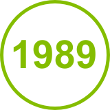 The year 1989 in a green circle